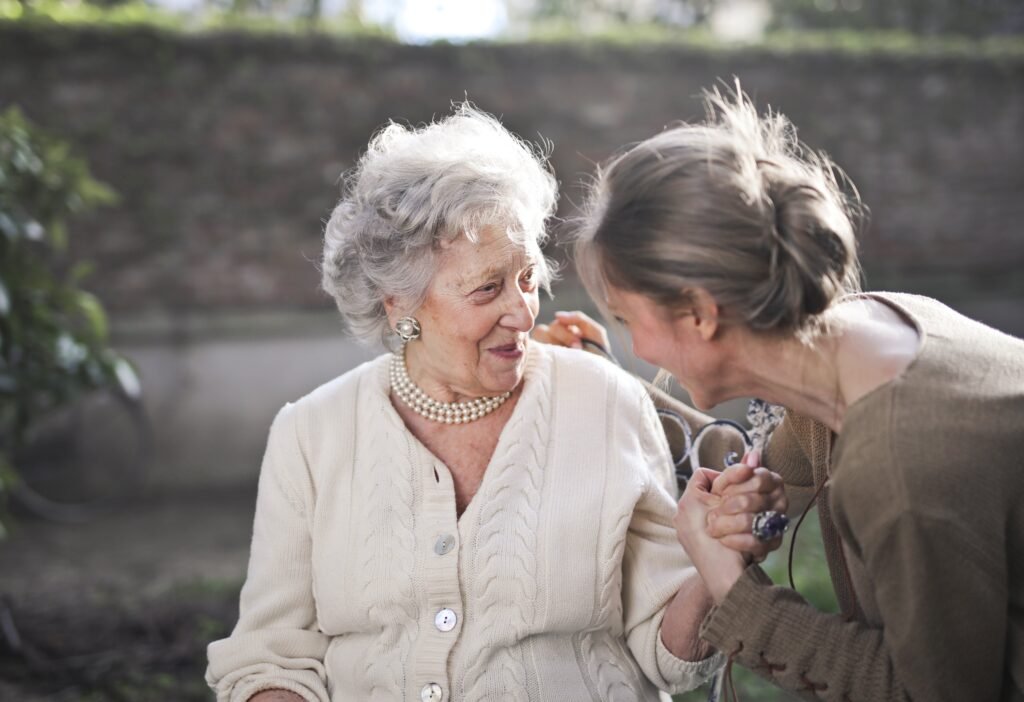 Caregiver providing compassionate home care for an elderly woman